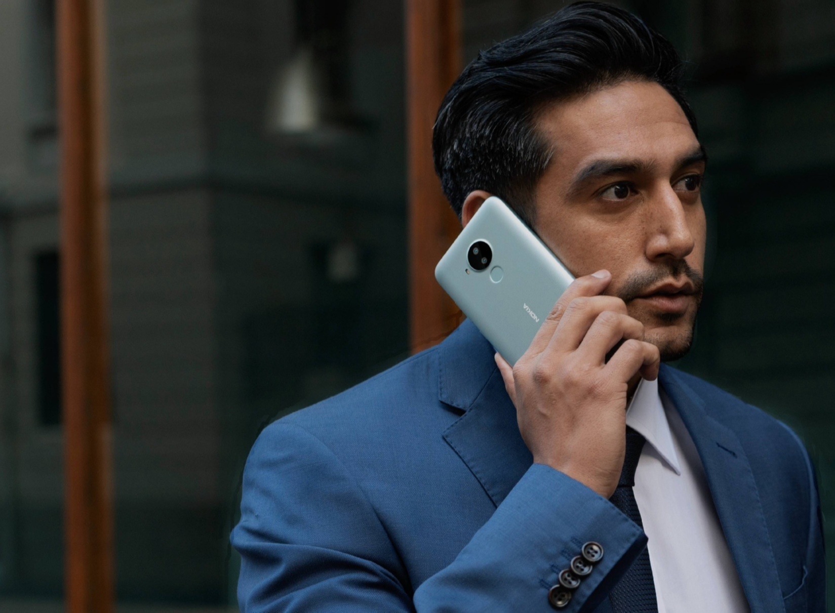 business man in blue suit talking on the phone-1-1