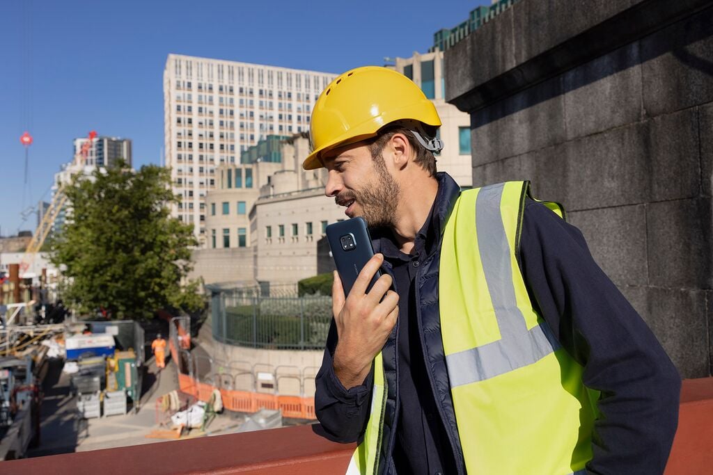 construction worker speaking on the phone